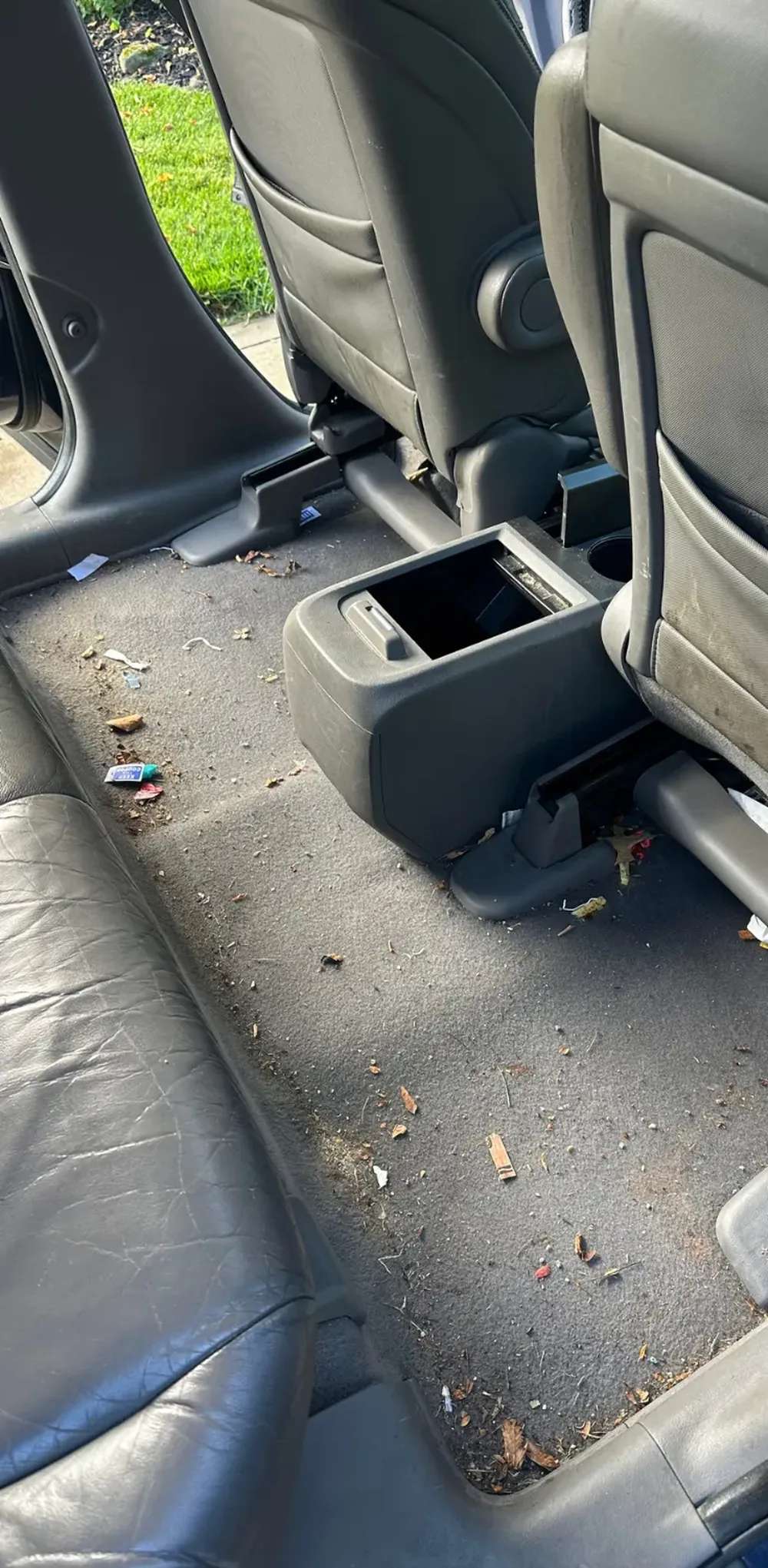 Honda CR-V, rear floor and leather seat, before cleaning