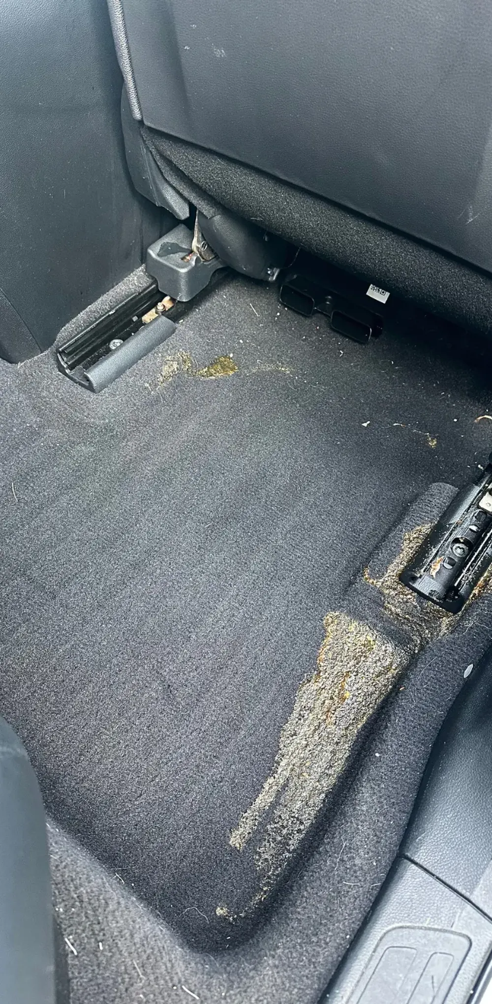 Acura RDX, rear passenger footwell, before cleaning