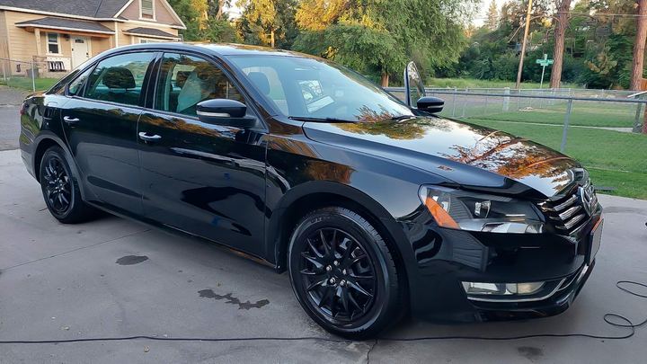 Polished black sedan on driveway